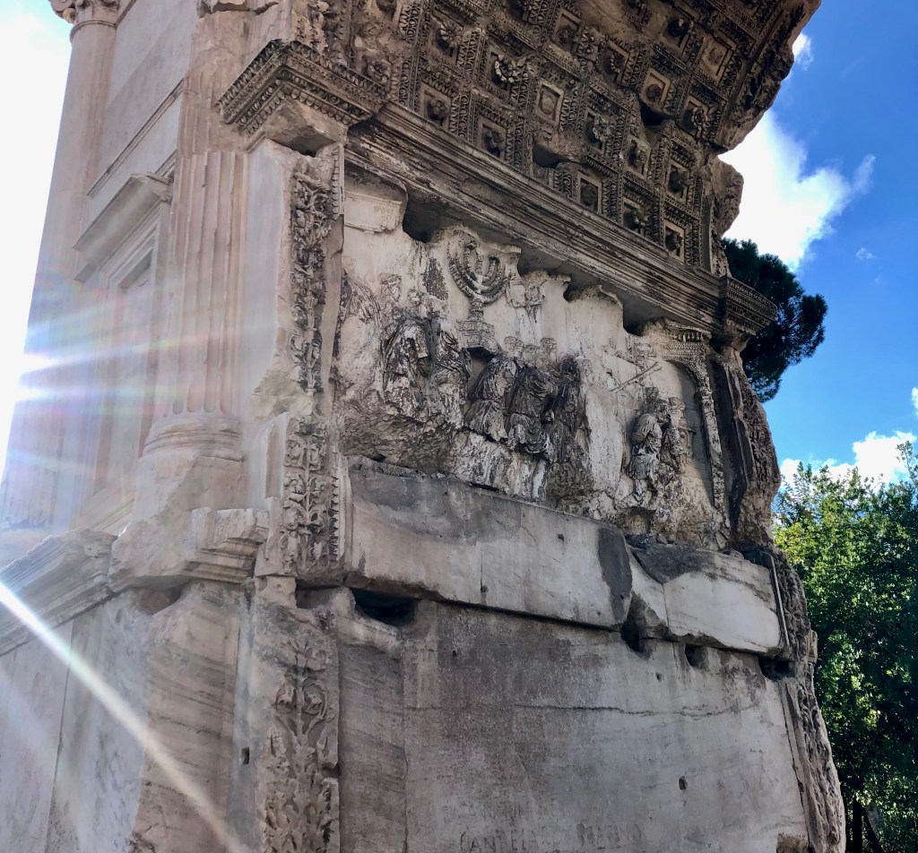 The interior panel of the Arch of Titus featuring a relief of soldiers carrying the menorah from Jerusalem.
